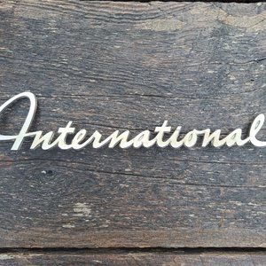 Vintage International truck emblem script.